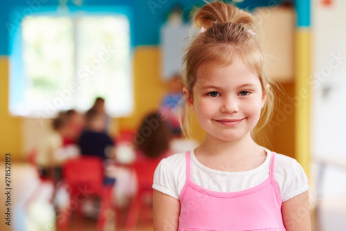 Portrait of smiling child in the preschool © gpointstudio