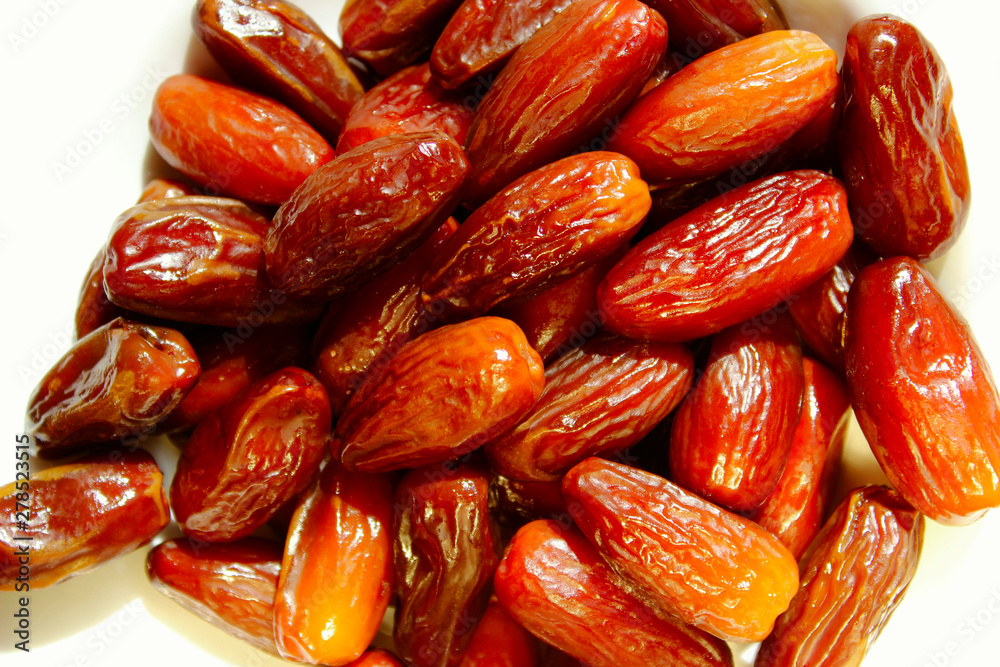 Cropped shot of date fruit isolated over white background. Healthy food concept. Cropped shot of date fruit isolated over white background. Healthy food concept.