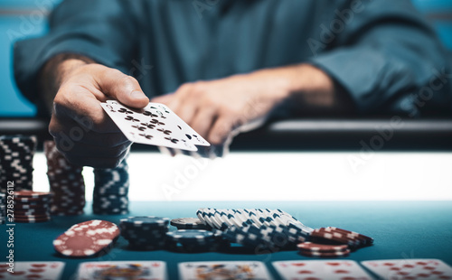 Man playing Texas Hold 'em poker at Casino