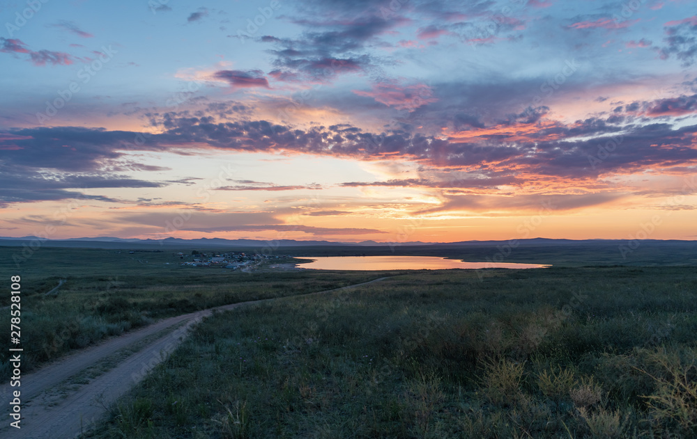 Landscape in Tuva. Dus-Hol lake and road in field