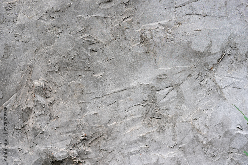 texture uneven plaster. Gray stucco background with careless pieces