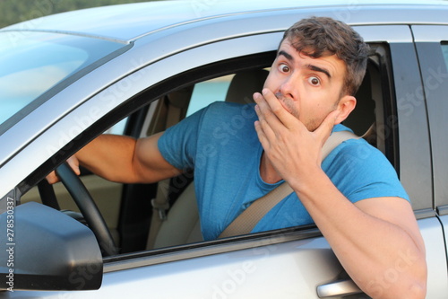 Terrified male driver feeling guilty