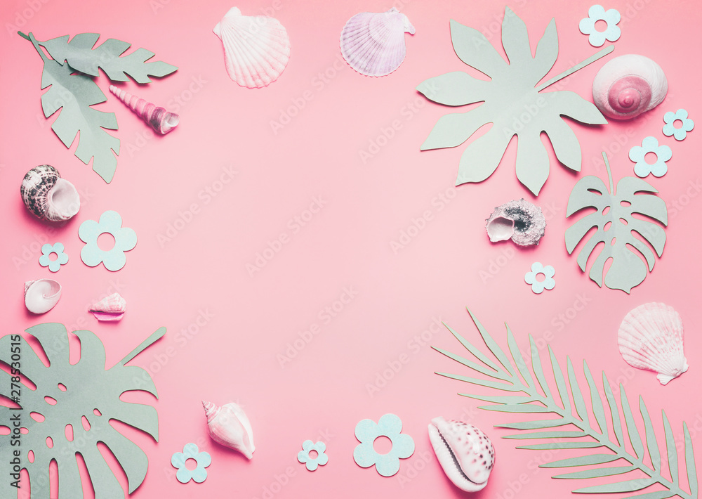 Frame of sea shells and tropical leaves on pastel pink background, top view.  Creative layout. Flat lay. Summer concept