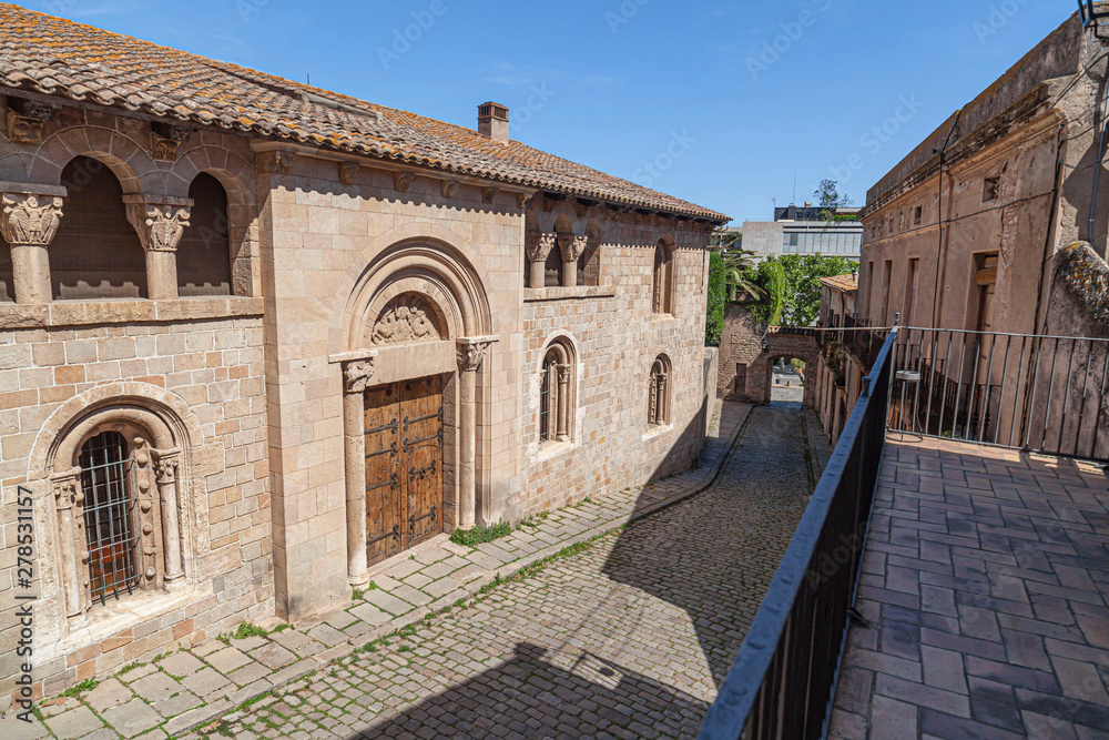 Fototapeta premium Ancient street in old walled enclosure of Monastery of Pedralbes, Barcelona, Catalonia, Spain.