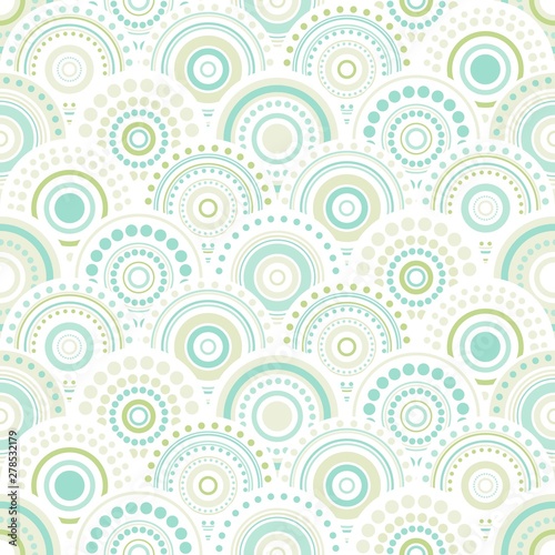 Seamless abstract pattern of circles and dots of green and turquoise colors.