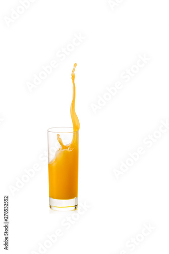 splash of orange juice in glass isolated on white background.