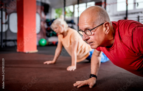 Senior people doing rehab workout at the gym