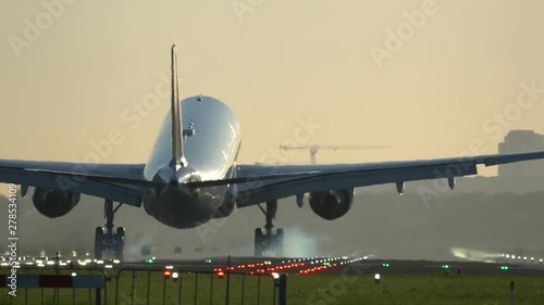 Closeup slow motion of landing airplane