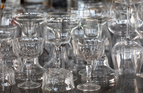 Glassware on a stainless steel hotel bar 