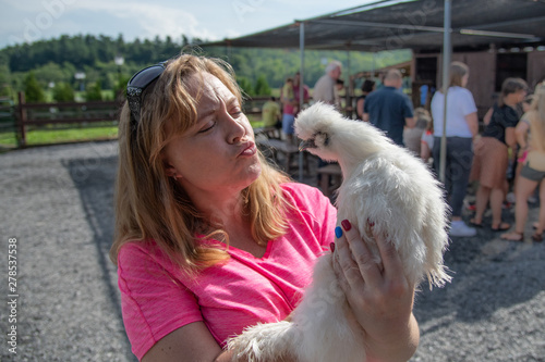 Woman with a Chicken at a farm in Asheville, NC photo