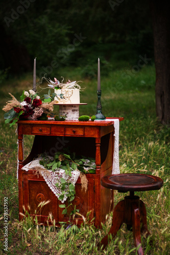 wedding location photo zone candles flowers cake forest glade tree leaves decoration nightstand chair