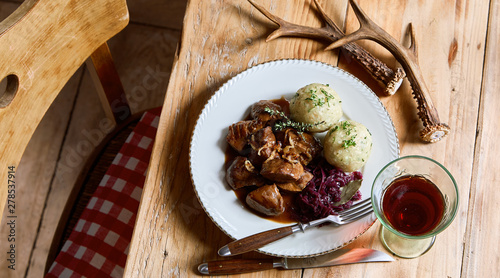 Konstfotografi Serving of wild venison goulash and dumplings