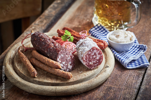 Wooden board with assorted wild venison sausages