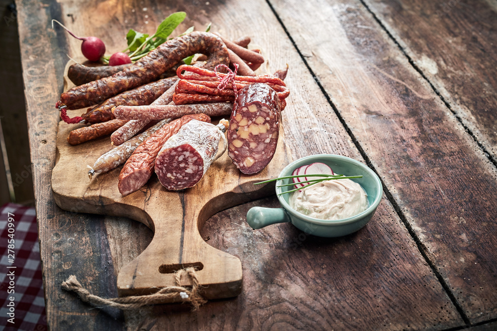 Buffet selection of dried spicy venison sausages - obrazy, fototapety, plakaty 