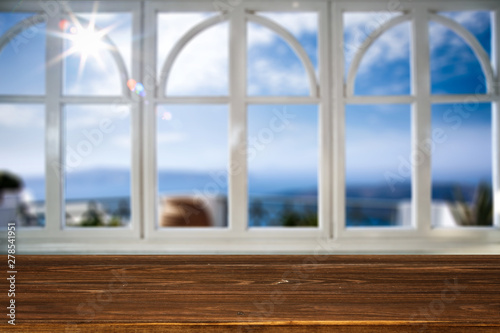 Table background with a beautiful ocean sunny window view