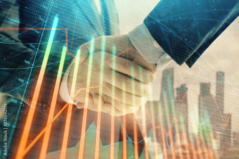 Double exposure of financial graph on cityscape background with two businessman handshake. Concept of stock market deal