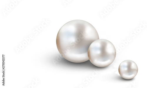 Two large white pearls on blue and white cloudy blur background