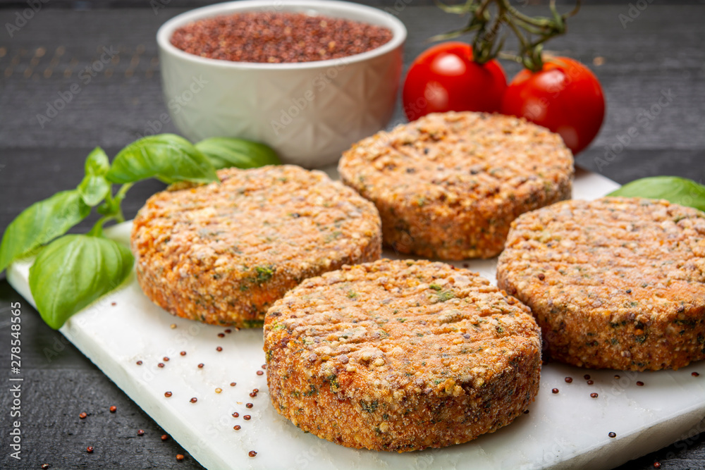 Tasty vegetarian burgers made from healthy quinoa, basil, tomatoes and mozzarella cheese Tasty vegetarian burgers made from healthy quinoa, basil, tomatoes and mozzarella cheese