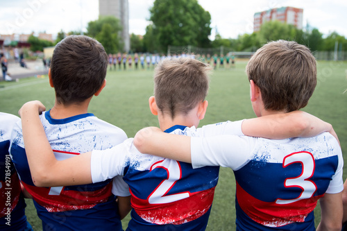 Football team boys support each other photo