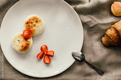 Tasty breakfast cheesecakes with coffee. Cheese pancakes