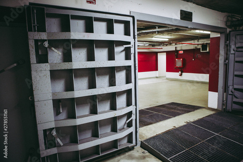 Schilderij op canvas Details with the heavy metal doors of a nuclear explosion shelter (fallout shelter), four stories below ground in a deep underground parking place