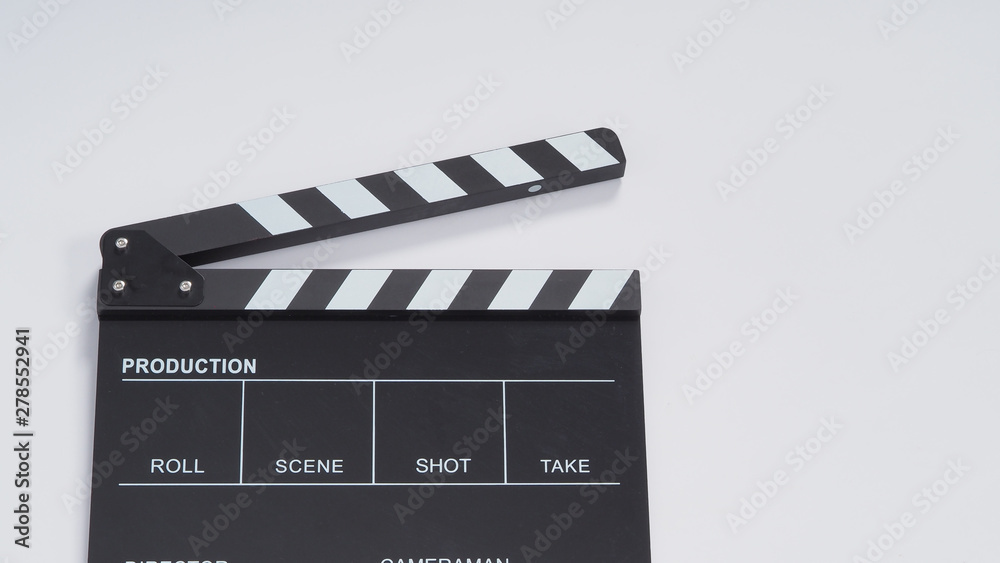 Clapperboard or movie slate use in video production, film and  cinema industry. It's black color on white paper background.