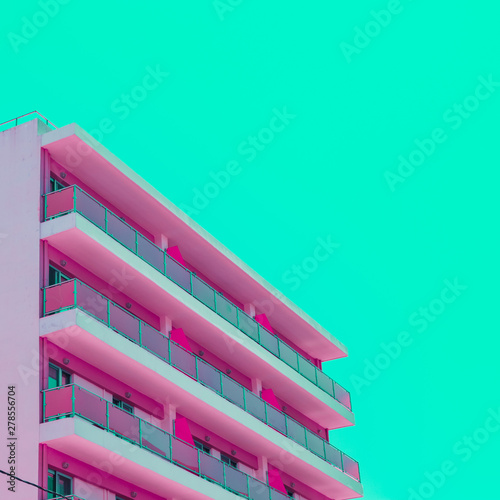 Foto Pink hotel and green sky in infrared style