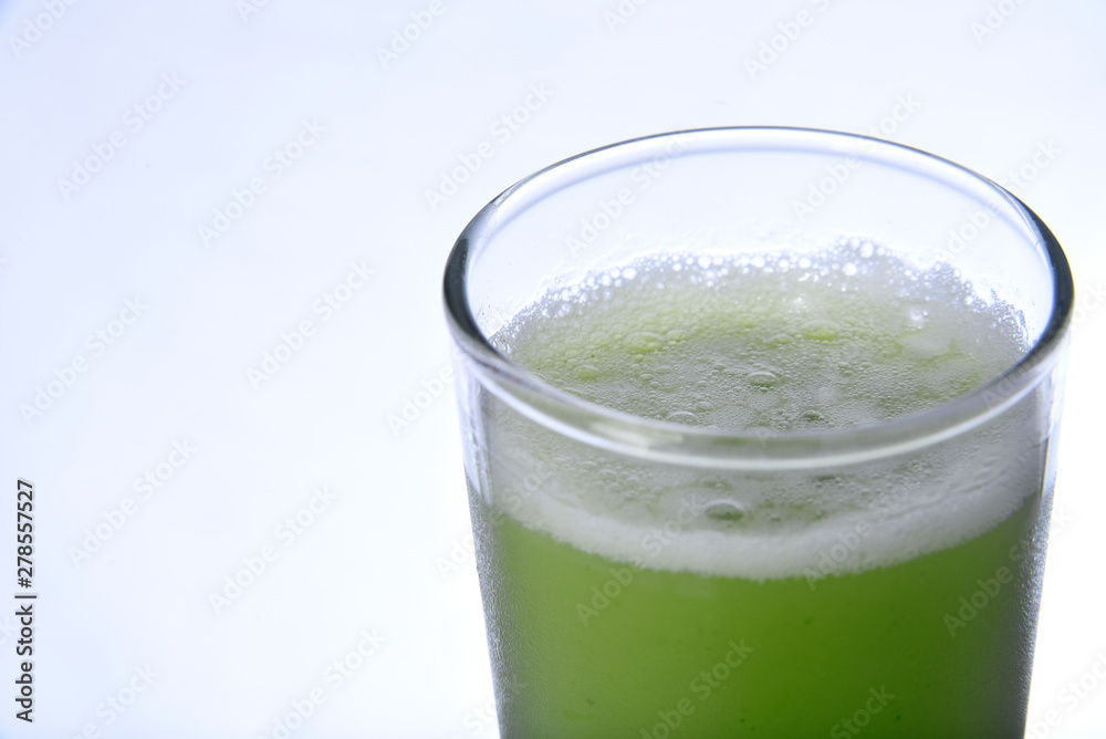 green juice with natural fruits on white background green juice with natural fruits on white background
