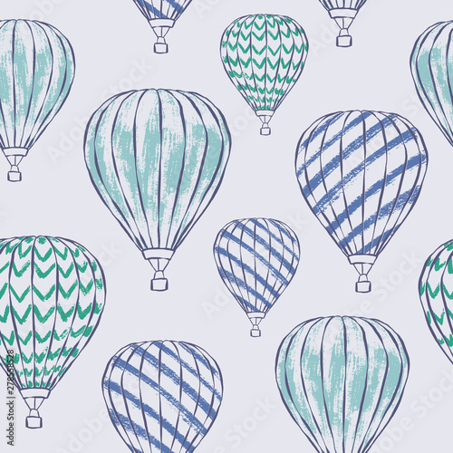 Vector seamless pattern of green and blue hot air balloons in the sky. Boys Nursery illustration great for wallpaper, wrapping and decor.