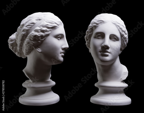 Statue. On a black isolated background. Gypsum statue of Aphrodite's head. photo