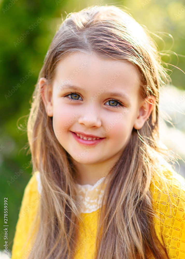 portrait of little girl outdoors in summer portrait of little girl outdoors in summer