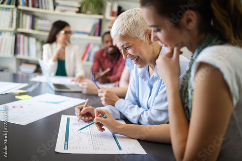 Group of successful business people at work in office