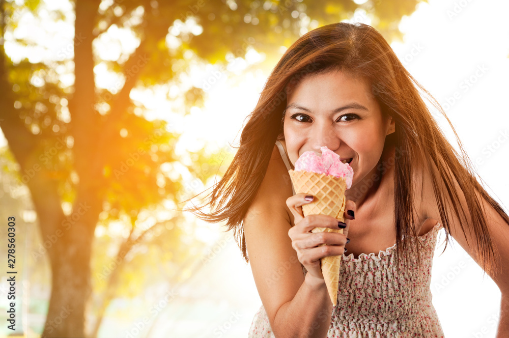 Pretty woman with ice cream at hot summer day. Pretty woman with ice cream at hot summer day.