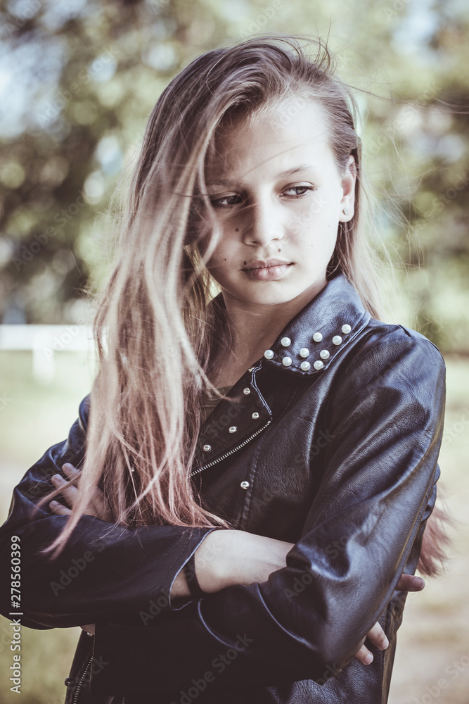 Sad teen girl in leather jacket Stock-Foto | Adobe Stock