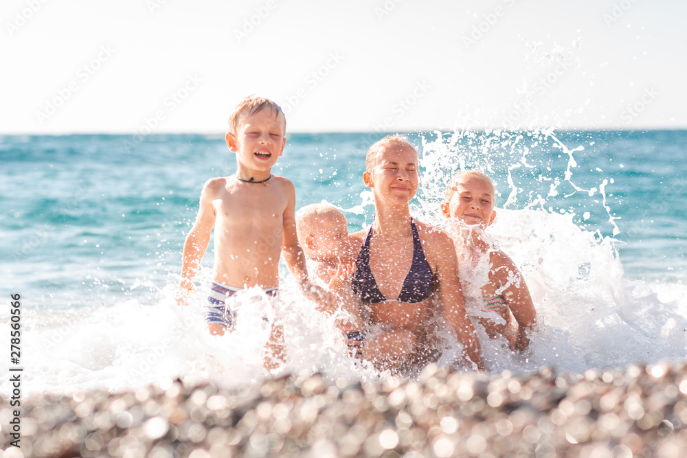 Happy kids on the beach having fun