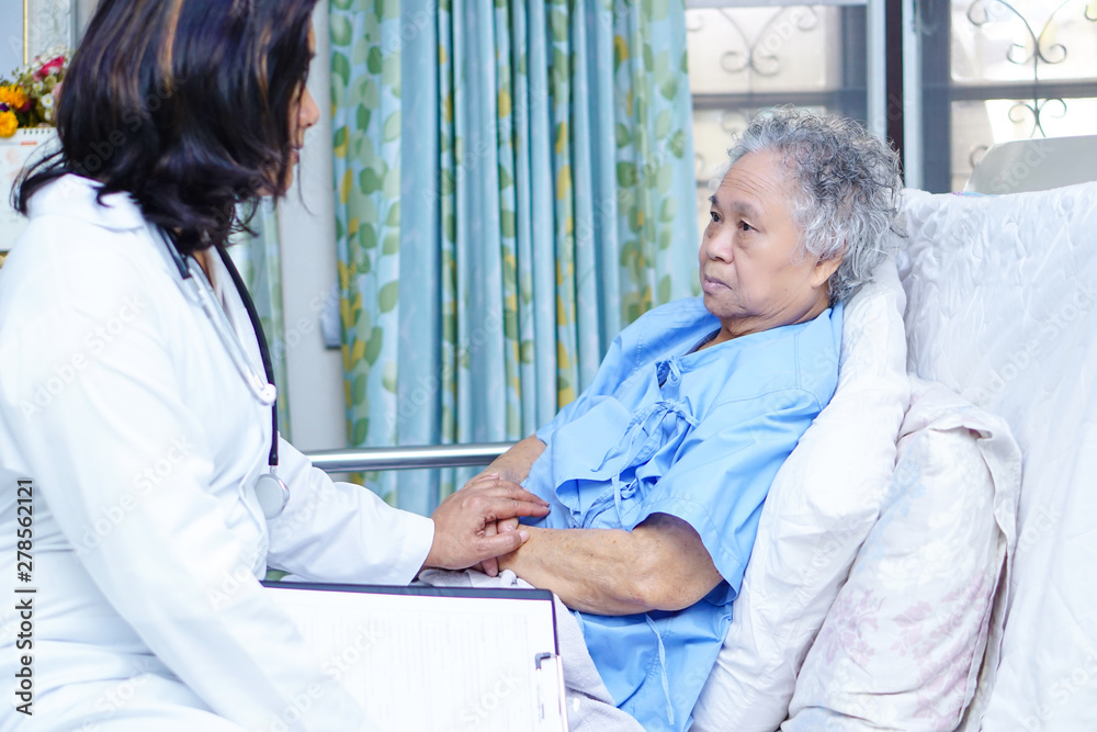 Obraz premium Doctor care, help and support senior or elderly old lady woman patient at hospital ward : healthy strong medical concept.