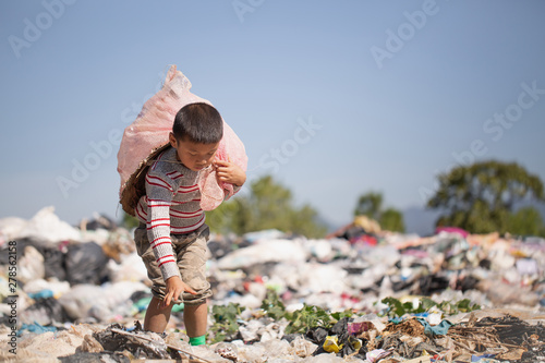Poor children collect garbage for sale because of poverty, Junk recycle, Child labor, Poverty concept, World Environment Day,