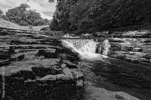 The popular Stainforth Force on the River Ribble near Little Stainforth in the Yorkshire Dales. Black and white image.