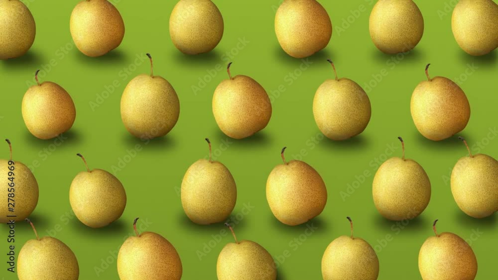 Colorful fruit pattern of fresh yellow pears on green background. 4k video Colorful fruit pattern of fresh yellow pears on green background. 4k video