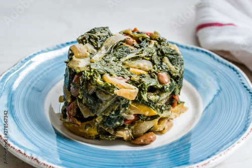 Homemade Healthy Chard Food with Olive Oil, Almonds and Julienne Vegetables Turkish Food Pazi. Traditional Organic Dish.