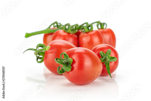 Lot of whole fresh red tomato cherry isolated on white background