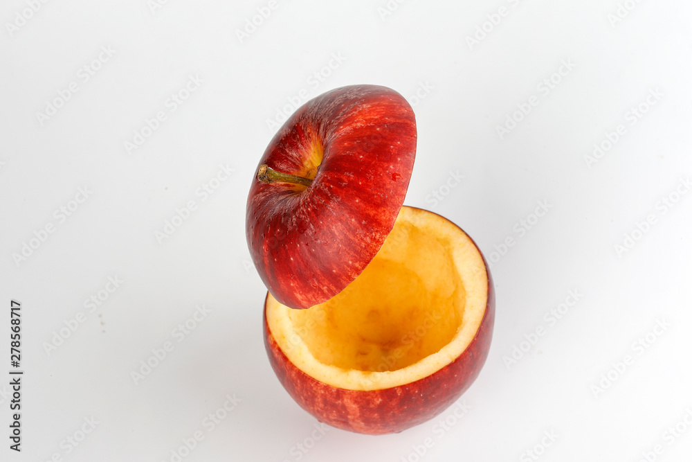 Health Red Cut Apple floating top slice juice drink idea concept on white background Health Red Cut Apple floating top slice juice drink idea concept on white background