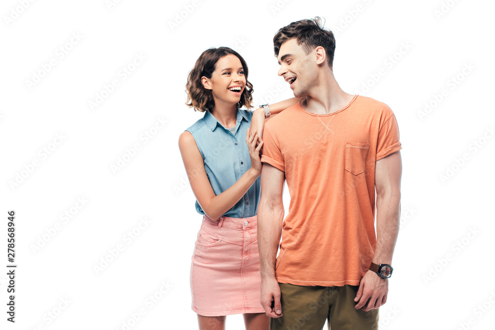 happy young couple smiling while looking at each other isolated on white happy young couple smiling while looking at each other isolated on white