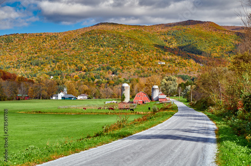 Farm with red barn and silos at sunny autumn day in West Arlington, Vermont, USA photo