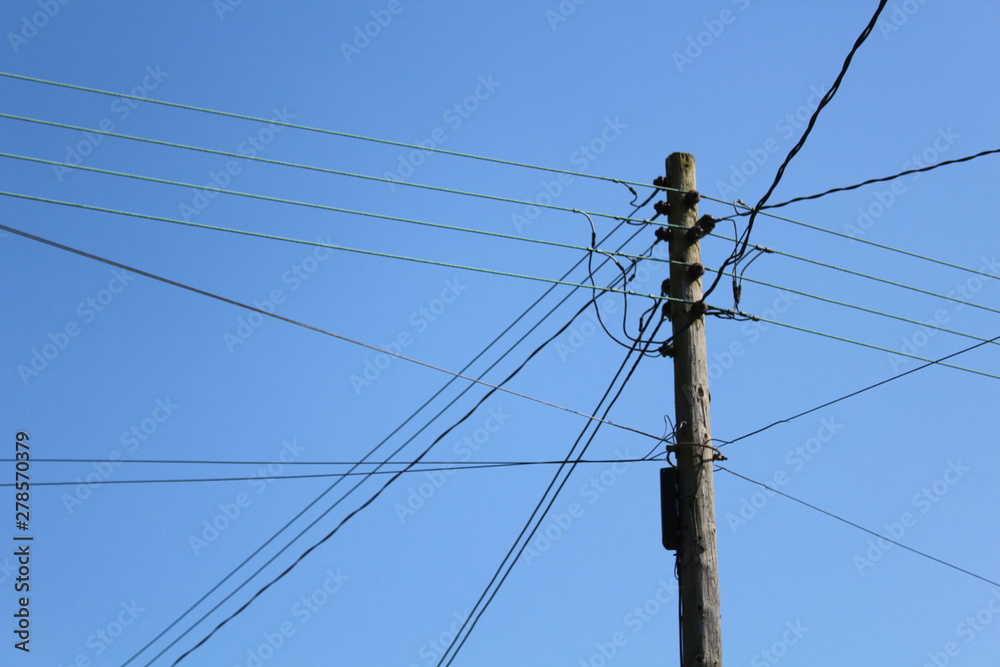 Old power telephone pole and wires blue sky Old power telephone pole and wires blue sky
