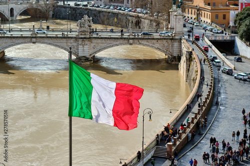 Canvas Print Rome and Tiber river with high water in February and flag of Italy
