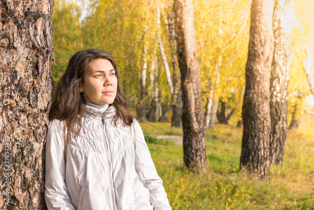 Beautiful girl at white birch on sunny autumn day. Beautiful girl at white birch on sunny autumn day.