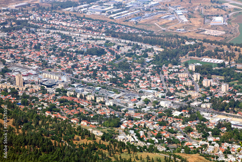 Fototapeta premium Spring amazing view from top of Manara Cliff on Kiryat Shmona city, colorful agricultural valley and Golan Heights. North of Israel