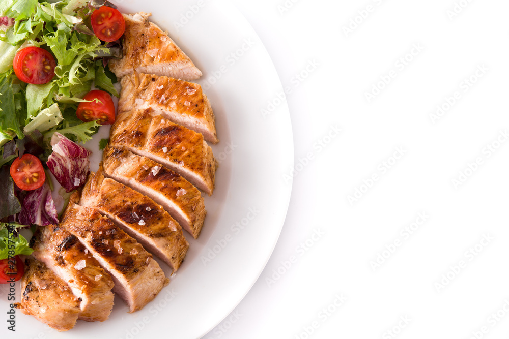 Grilled chicken breast with vegetables on a plate isolated on white background. Top view. Copyspace