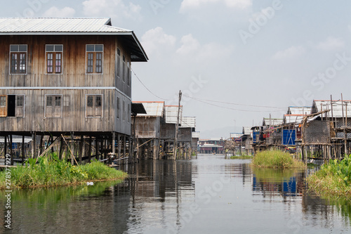 Traditional Burmese floating house on water in Inle lake, Myanmar © oleksii.leonov